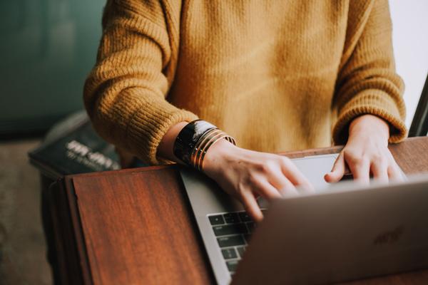 Woman typing on laptop Woman typing on laptop
